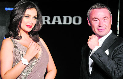 Model and Rado brand ambassador Lisa Ray (L) with Thomas Leutenegger, Rados regional sales manager, displaying the Rado True Thinline watch at its launch in New Delhi on Thursday. Rado launched its thinnest high-tech ceramic collection of watches with a height of as little as 4.9 millimeters and weighing only 35 grams, showcasing its technological proficiency and aesthetic precision. 