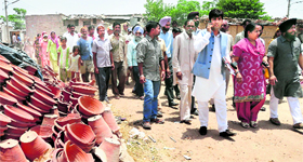 BJP councillors take a round of the Kumhar and Gwala colonies with local residents at Maloya in Chandigarh on Thursday.