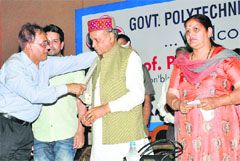 Director of Technical Education Vijay Chandan honours Chief Minister PK Dhumal at Polytechnic College, Badu, in Hamirpur on Thursday.