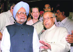 Pranab Mukherjee (R) with PM Manmohan Singh (L) and Sonia Gandhi in New Delhi. 