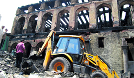 Work in progress at the gutted Dastageer Sahab shrine.