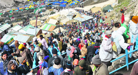 Pilgrims await their turn to pay obeisance at the holy cave of Lord Shiva.