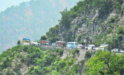 A long queue of stranded vehicles on the national highway near Ramban on account of Amarnath yatra. Tribune photo: Anand Sharma