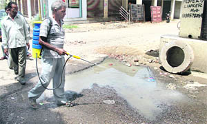 A team of the Health Department sprays disinfectants in the affected area at Basti Peerdad in Jalandhar on Thursday. 