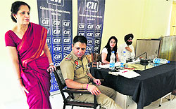 Psychiatrist Ravinder Kala (in sari) gives tips on stress management at police line in Ludhiana