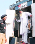 Surjeet Singh steps out of the jail van that brought him to Wagah on Thursday.  AFP
