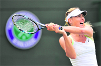 Maria Sharapova hits a backhand during her win over Tsvetana Pironkova at the All England Tennis Club in Wimbledon on Thursday.  AFP 
