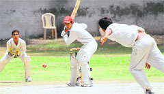 A batsman plays a shot during Haryana Cricket Tournament at Government Model Senior Secondary School, Sector 19, in Chandigarh, on Friday. 