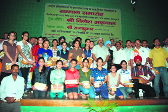 Sportspersons and coaches who were honoured at a function in Dehradun on Friday.
