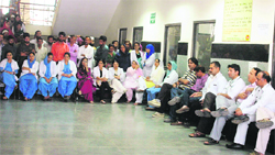 Doctors and paramedical staff of the District Hospital, Rajouri, sit in a dharna in the hospital complex. A Tribune photograph