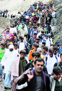 Devotees make their way towards the Amarnath cave shrine, 130 km south of Srinagar on Friday.