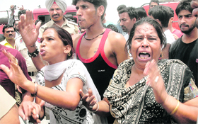 Relatives of the deceased mourn his death in Jalandhar on Friday.