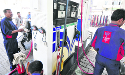 State-run fuel retailers cut petrol prices by ~2.46 per liter in Ludhiana on Friday. Tribune photo: Himanshu Mahajan 