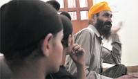 Jagjit Singh along with two of his sons in Ludhiana on Friday. Tribune photo: Himanshu Mahajan