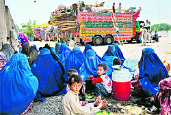 Afghan refugees at the UN High Commissioner for Refugees registration centre on the outskirts of Peshawar