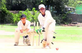 A girl plays a shot during a match in the Little Masters Cricket Tournament under way in Dehradun on Saturday