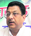 Vice-President of the Uttarakhand Congress Committee Suryakant Dhasmana addresses a press conference in Dehradun 