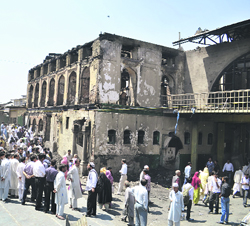 Devotees throng the Pir Dastageer shrine in Srinagar on Saturday.