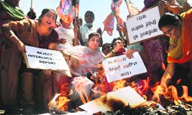 BJP Mahila Morcha activists protest against the report of interlocutors at Kachi Chawni Chowk in Jammu on Saturday