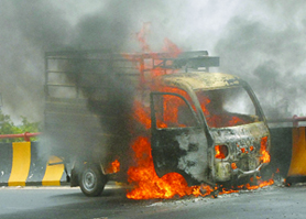 The vehicle, which was driven by deceased Vijay Pal, catches fire at Domoria ROB in Jalandhar on Friday. 