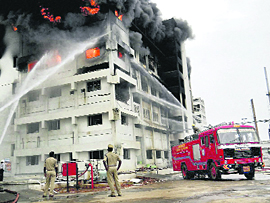 Firefighters try to douse a major fire that broke out at the Nagarjuna Agrichem plant at Chilakapalem village in Srikakulam district on Saturday.