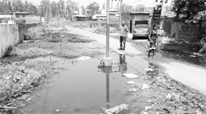 Industrial effluent water gets accumulated on a road at Focal Point, Dera Bassi. 