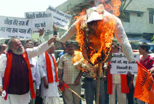 Activists of the Rashtrawadi Shiv Sena burn effigy of Delhi Chief Minister Sheila Dikshit during a demonstration against the shortage of water and privatisation of power distribution in New Delhi on Sunday.