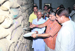 Food and Civil Supplies Minister Preetam Singh inspects a state Food Corporation godown at Ranipur in Haridwar on Sunday.