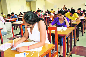 Students take the entrance test for admission to the MBBS course on the PGIMS campus in Rohtak on Sunday. 
