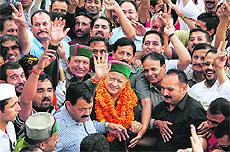 Former Union Minister Virbhadra Singh with his supporters in a jubilant mood in Shimla on Sunday. 