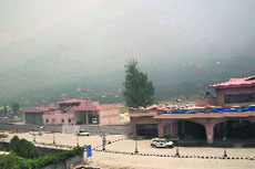The hazy fire-scorched skyline above the Bhuntar airport in Kullu where Rahul Gandhi will land on Monday.