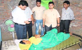 Another team, headed by District Health Officer Dr RL Bassan, visits a jaundice patient at Basti Peerdad in Jalandhar on Sunday