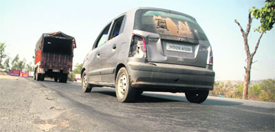 Uneven road between Nagrota and Saketar at national highway in Jammu. 
