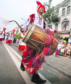 Participants from India march during the traditional Krasnoyarsk carnival, part of celebrations for the City Day, on the 384th anniversary of Russias Siberian city of Krasnoyarsk.