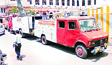 Fire Brigade employees park worn-out fire tenders in the middle of the MC office during a protest