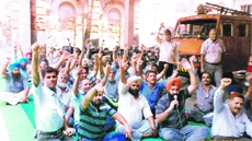 They raise slogans against the government and MC authorities in Amritsar on Monday.