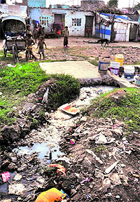 Stagnant water, a perfect breeding ground for mosquitoes and diseases, at Colony Number 5