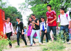 Students on the first day of the academic session at Government College in Dharamsala on Monday
