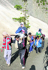 Devotees being carried to the cave shrine during the annual Amarnath yatr