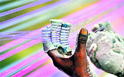 A professional thread maker prepares threads for flying kites in Jammu