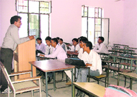 A few students attend a class on the first day of schools after summer vacations at a government school in Ludhiana on Monday.
