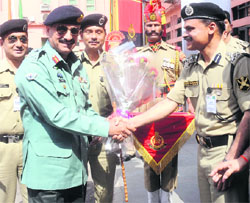 Director-General of Pakistani Rangers (Sindh) Maj-Gen Rizwan Akhtar (left) being welcomed by BSF personnel in New Delhi on Monday.