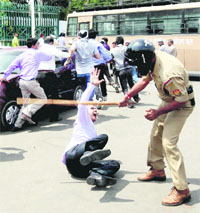 Police cane charges members of National Integrated Medical Association who were staging a protest march towards Vidhan Bhawan in Lucknow on Monday.