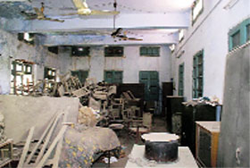 Piles of broken furniture lying in one of the rooms at the institute.