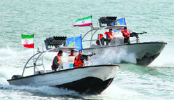 Iranian Revolutionary Guards drive speedboats during a ceremony to commemorate the 24th anniversary of the downing of Iran Air flight 655 by the US navy, at the port of Bandar Abbas on Monday.  AFP