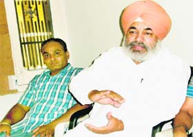 Congress leader Sukhjinder Raj Singh Lalli Majithia and his cousin Gurpreet Singh address mediapersons in Amritsar on Tuesday