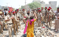 The Municipal Corporation Bathinda had to use heavy police force to tackle the protesting Prajapat Colony residents as the demolition drive continued in the area on Tuesday