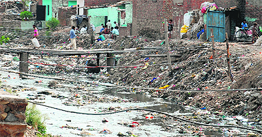 A filthy nullah flowing at Rajiv Colony bordering Chandigarh; 