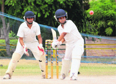 A batsman plays a shot during a match between MCA (A) and MCA (B) at Phase IX, Mohali, on Tuesday