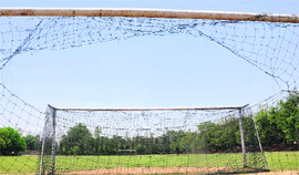 A view of the Panjab University football grounds with torn goal-post nets.